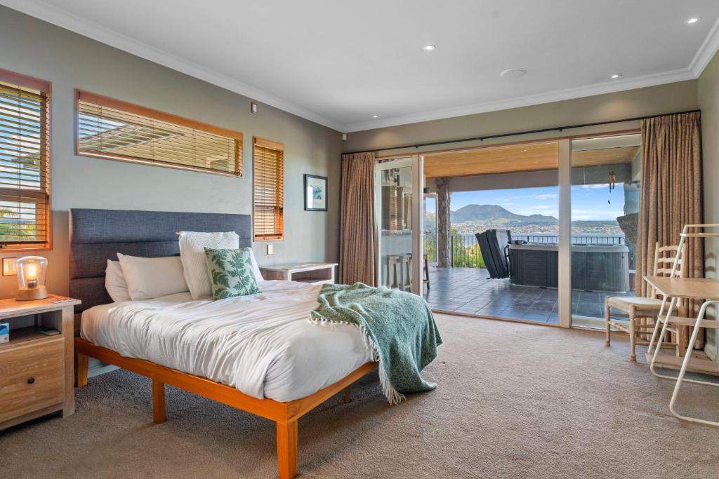 Master bedroom opening onto the lake view deck