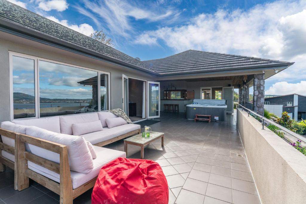 Sun deck with outdoor seating and hot tub
